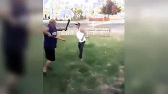 Dudes engage in a bat duel