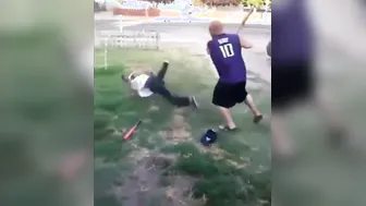 Dudes engage in a bat duel