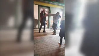 Drunk guy gets laid out in a karate chop fight.