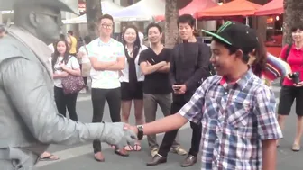 Man Gets Schooled By Street Performer For Messing With Him