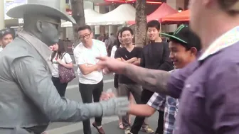 Man Gets Schooled By Street Performer For Messing With Him