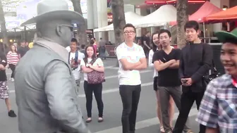 Man Gets Schooled By Street Performer For Messing With Him