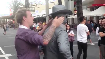 Man Gets Schooled By Street Performer For Messing With Him