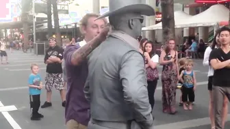Man Gets Schooled By Street Performer For Messing With Him