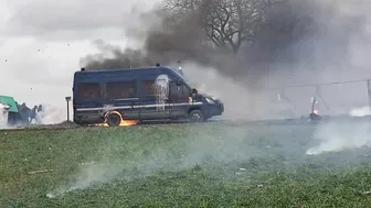Police And Protesters Clash In Sainte-Soline, France. Police Vehicles Set On Fir