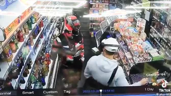Man tries to rob a guy in a supermarket but it doesnt go his way.