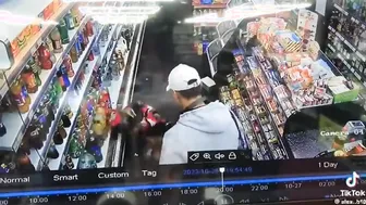Man tries to rob a guy in a supermarket but it doesnt go his way.